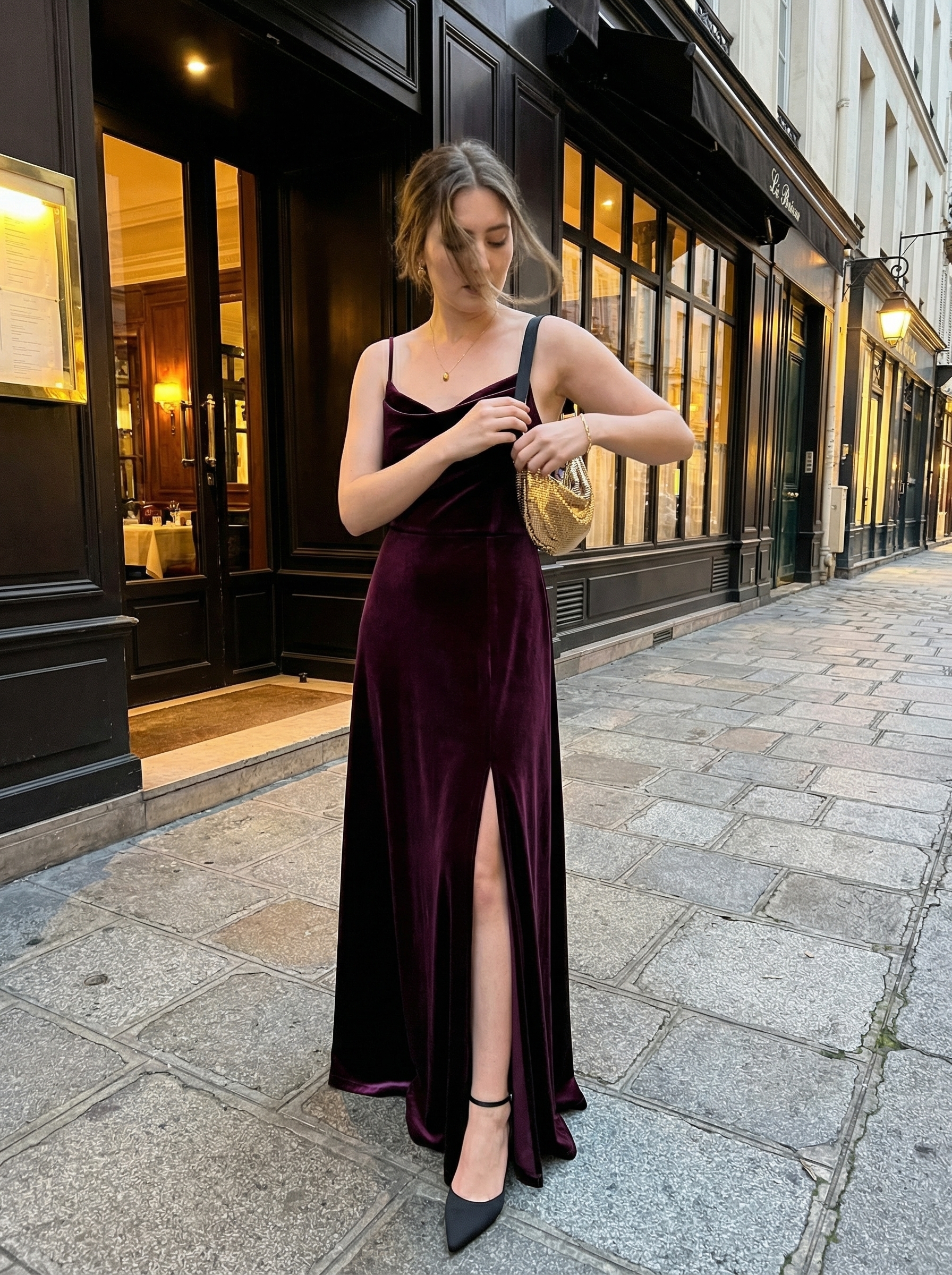 Velvet Dream Birthday Dresses 2024 Luxurious plum velvet midi slip dress with a cowl neck, black satin stilettos, a gold chainmail bag, and a delicate gold pendant necklace; stunning birthday dresses.