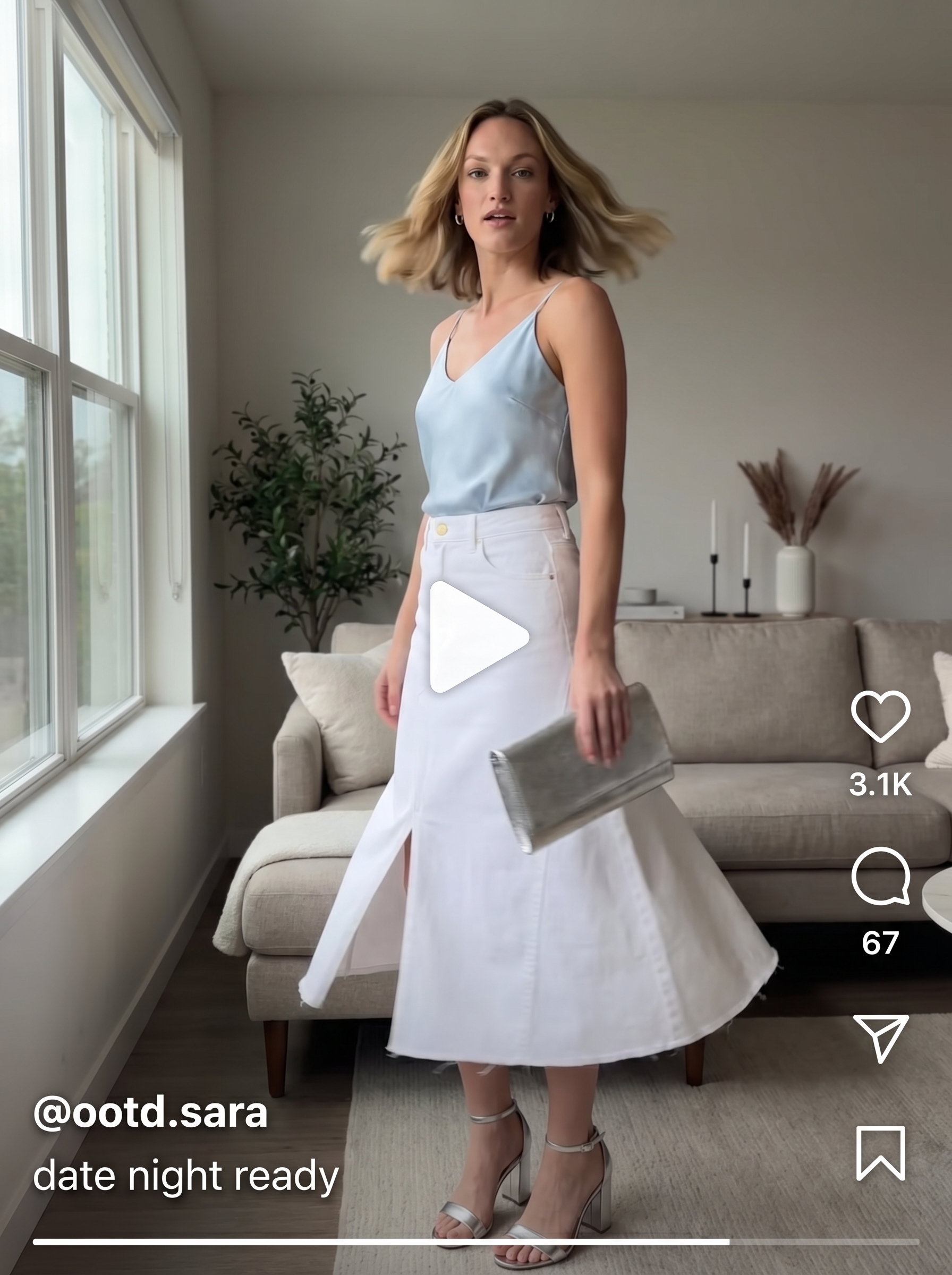 A sophisticated cool summer outfit featuring a white denim midi skirt and a sky blue satin camisole for a dinner out or summer date night. Complete with silver block heels and clutch.