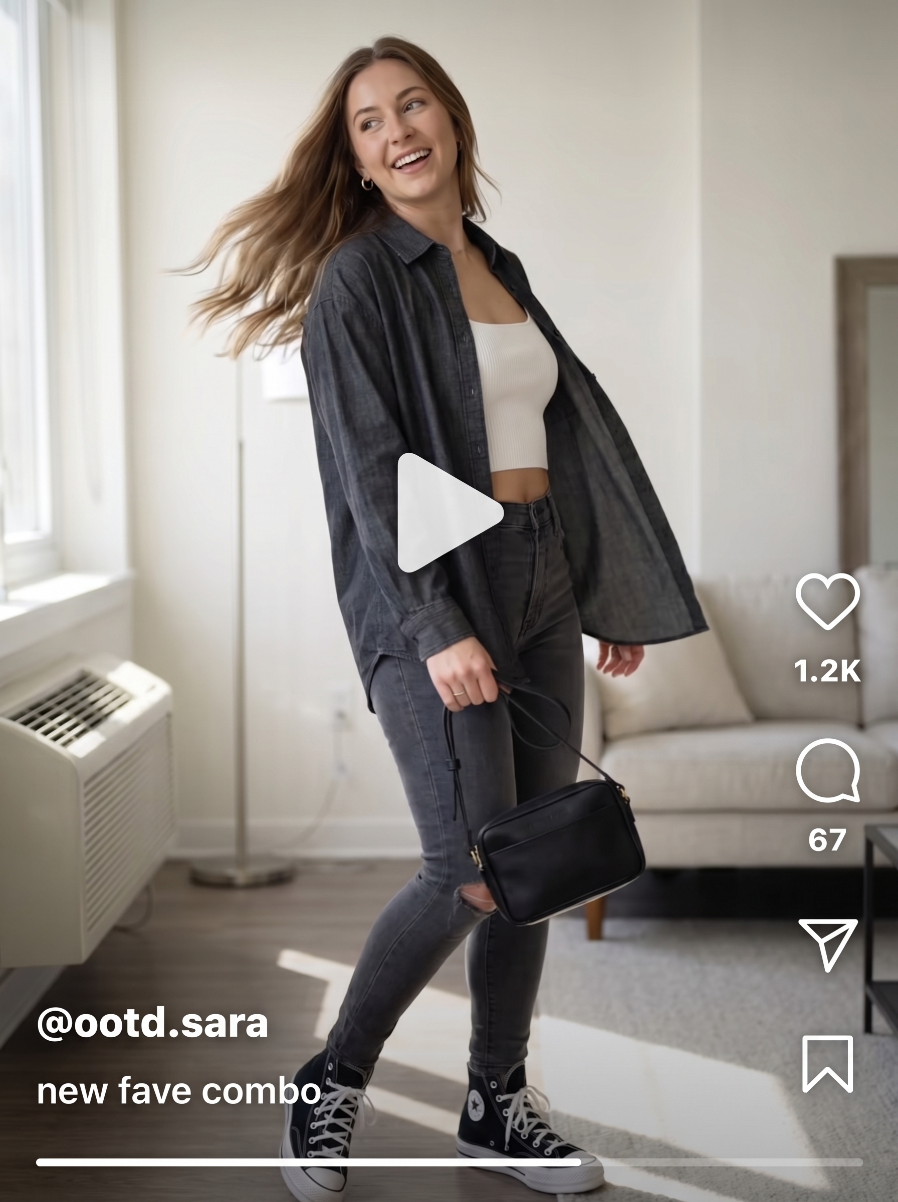 Relaxed artistic grungy summer outfit 2026 with a black oversized button-down shirt layered over a white ribbed crop tank, charcoal ripped skinny jeans, and black high-top sneakers.