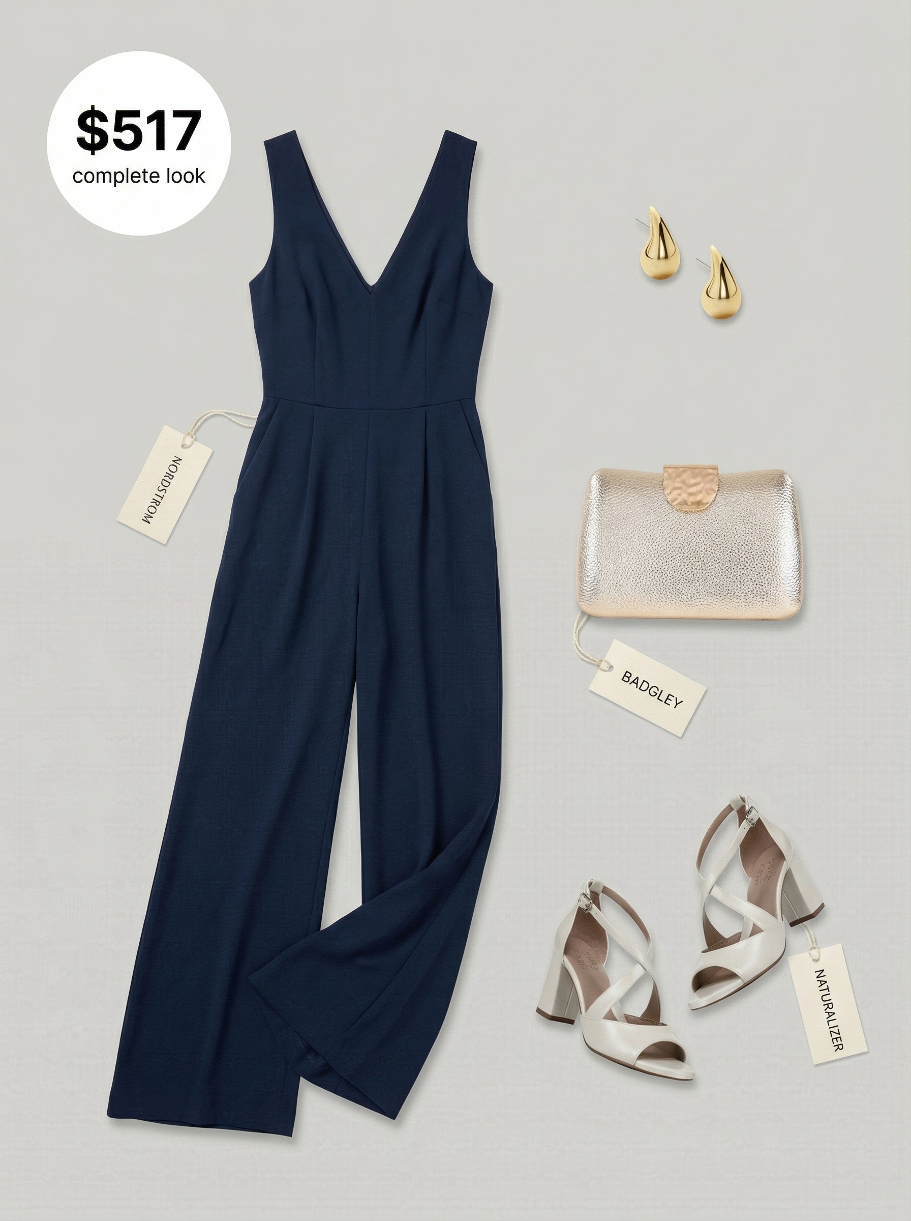 Modern navy blue wide-leg jumpsuit with a V-neck, styled with gold statement earrings, a metallic gold clutch, and off-white heeled strappy sandals, for stylish late summer outfits.