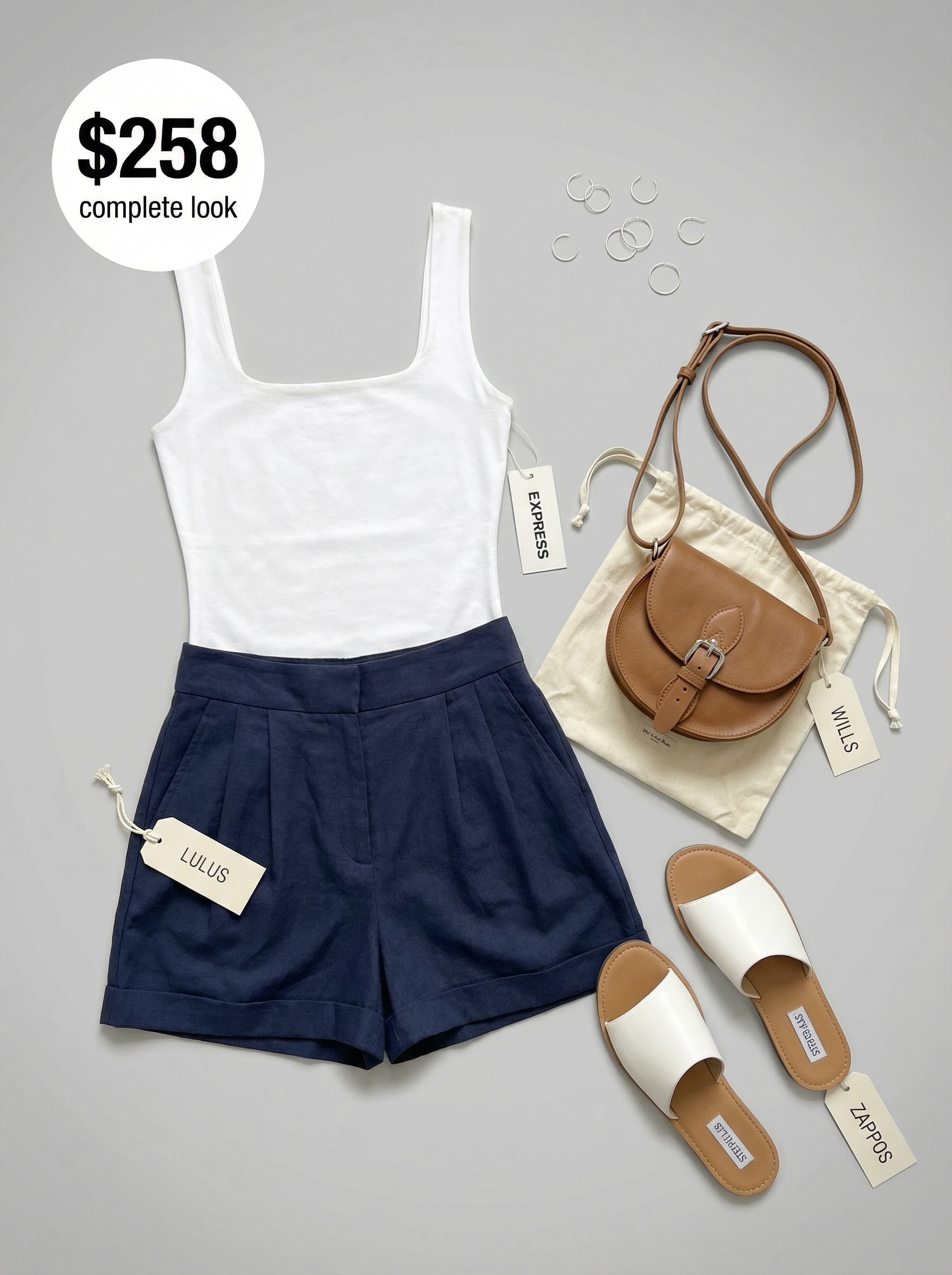 Polished navy linen shorts late summer outfit with a white square-neck tank, white slides, tan saddle bag, and silver hoop earrings for city sightseeing.