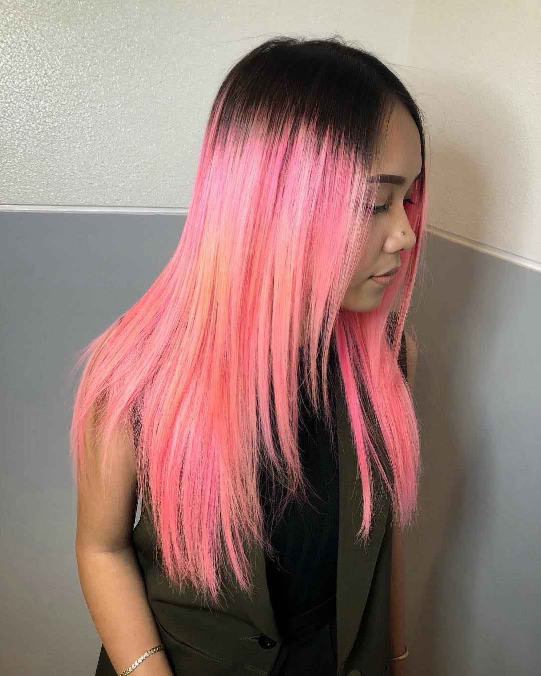 Close-up of a woman with natural-looking soft summer hair color, featuring cool, ash-blonde tones, styled in loose waves, perfect for a casual daytime look or an evening out.