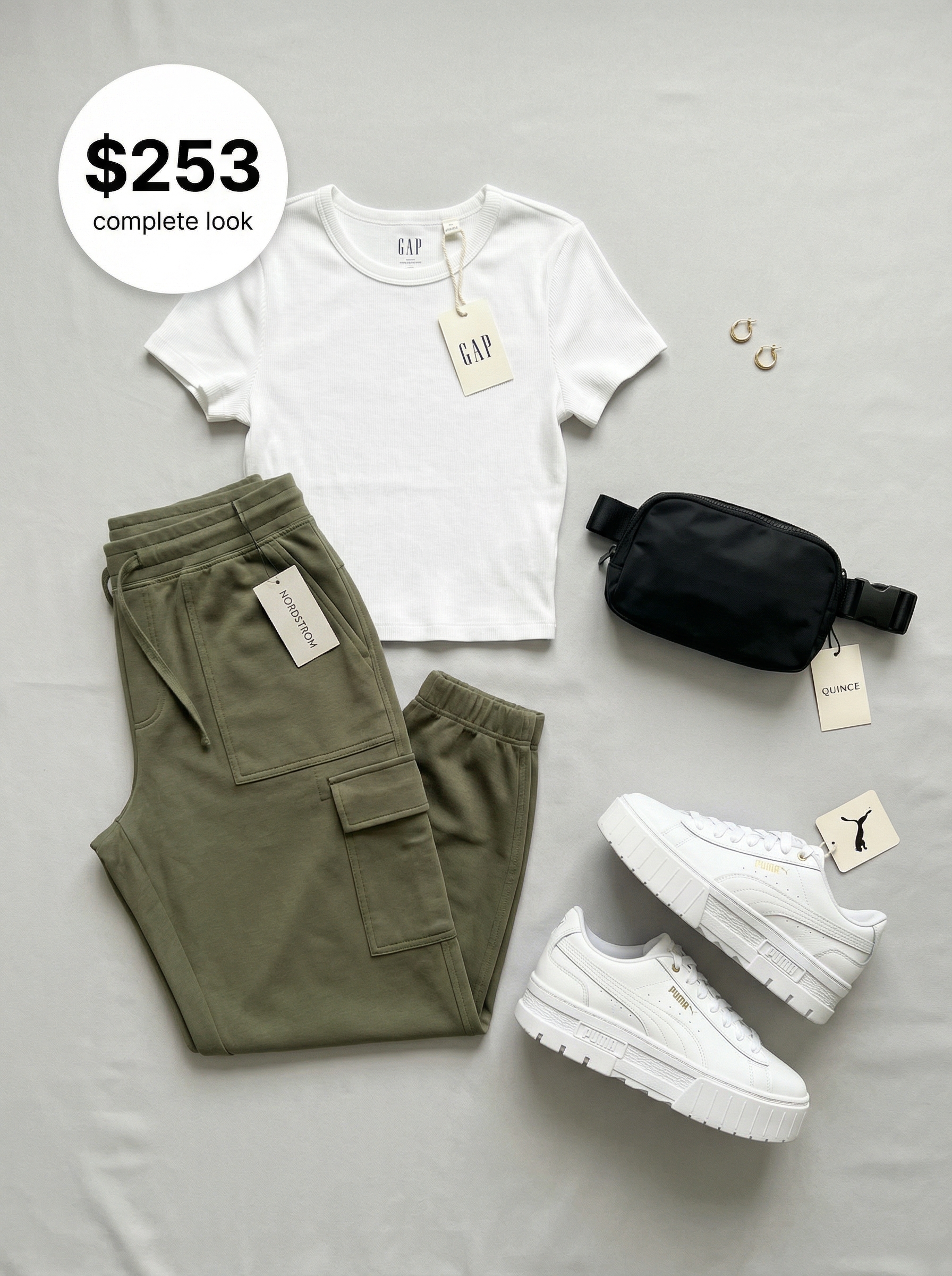 Urban chic black crop top, olive green tapered joggers with a black belt bag, and white platform sneakers for stylish summer athleisure outfits 2026.