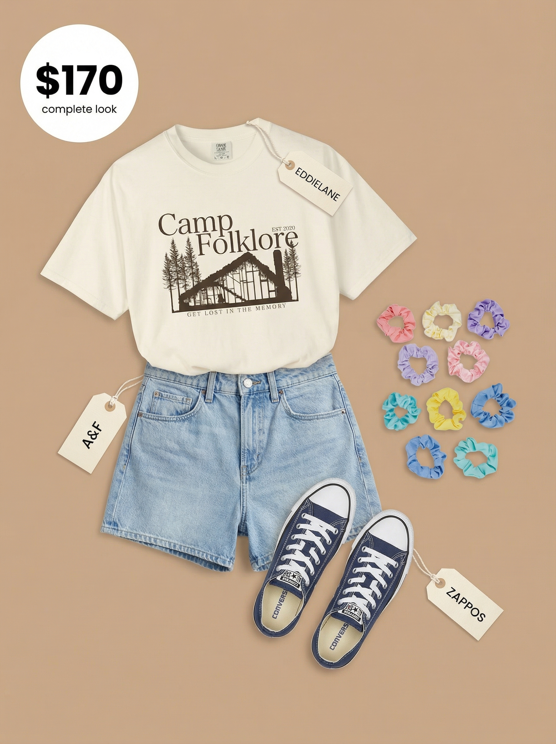 Campfire Cozy Chic Outfit 2024 Cozy off-white vintage graphic tee, light wash denim shorts, navy canvas sneakers, and pastel scrunchie, ideal summer camp outfit.