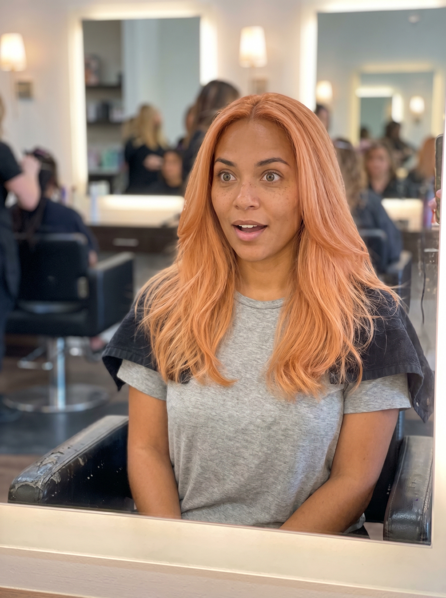 Soft and ethereal peach fuzz copper hair, perfect for gentle summer copper hair ideas 2026. This fashion-forward look features light copper, pastel peach, and rose gold tones.