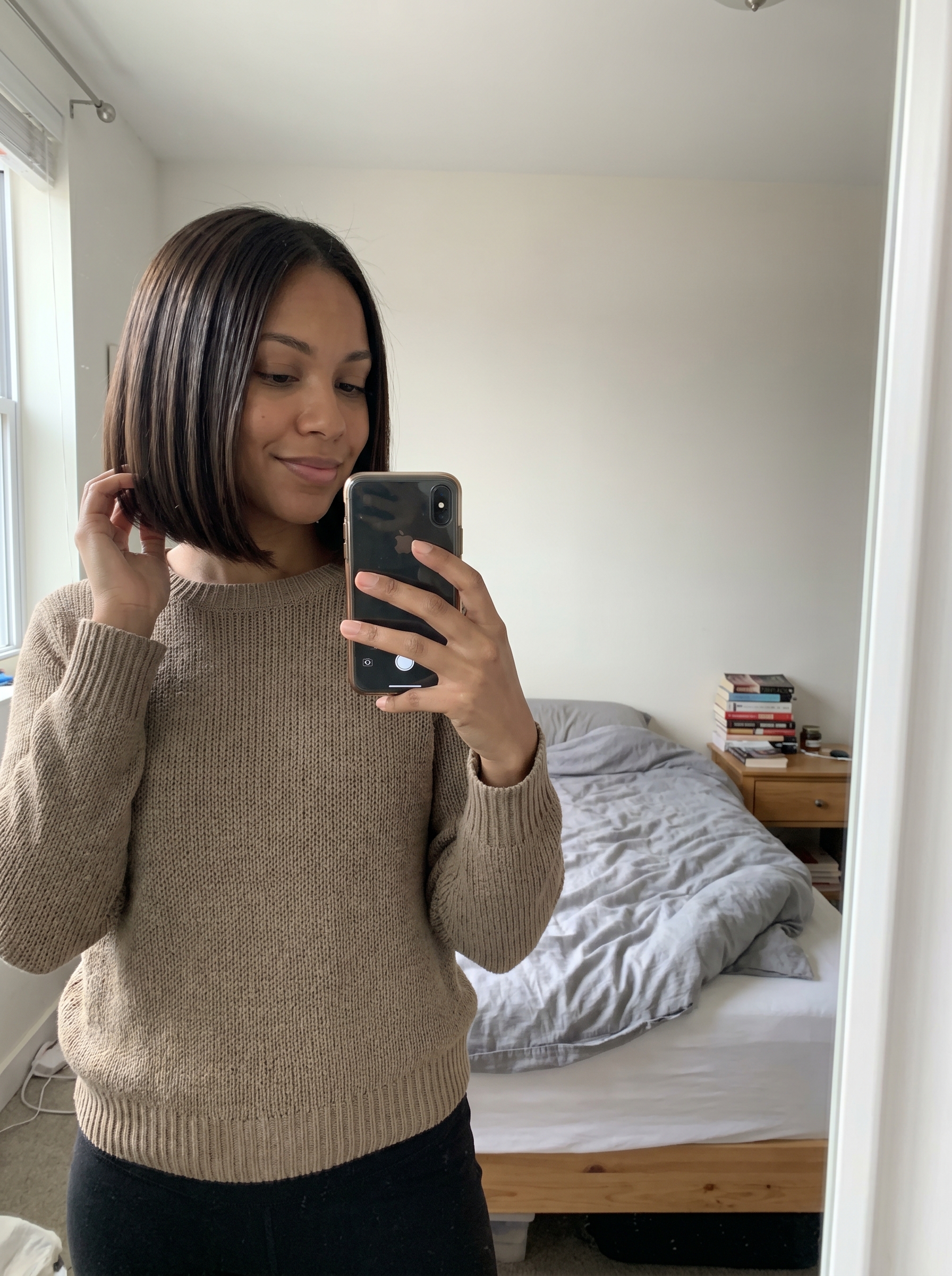 Sophisticated Hydro-Bob in Deep Brunette, a sleek summer hairstyle for short hair 2026, achieving a 'clean girl' aesthetic.