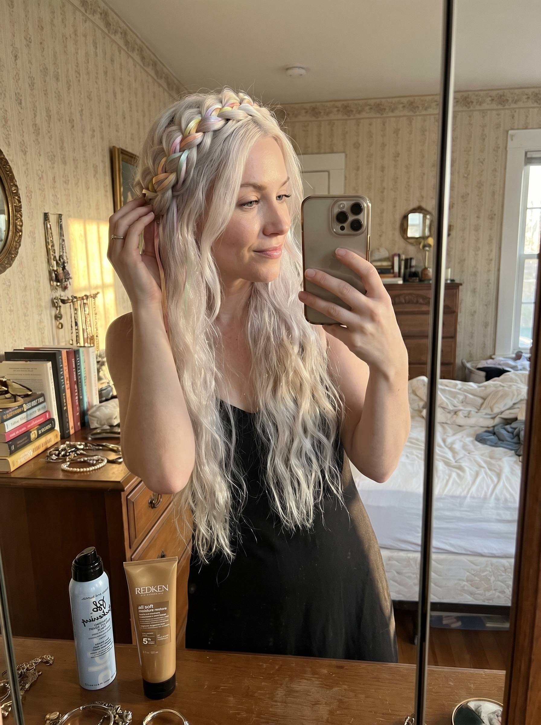 A romantic soft botanical braided crown adorned with thin pastel silk ribbons, perfect for summer hairstyles for long hair 2026. This ethereal look, styled with a large barrel curling iron and leave-in cream, is ideal for weddings or date nights.