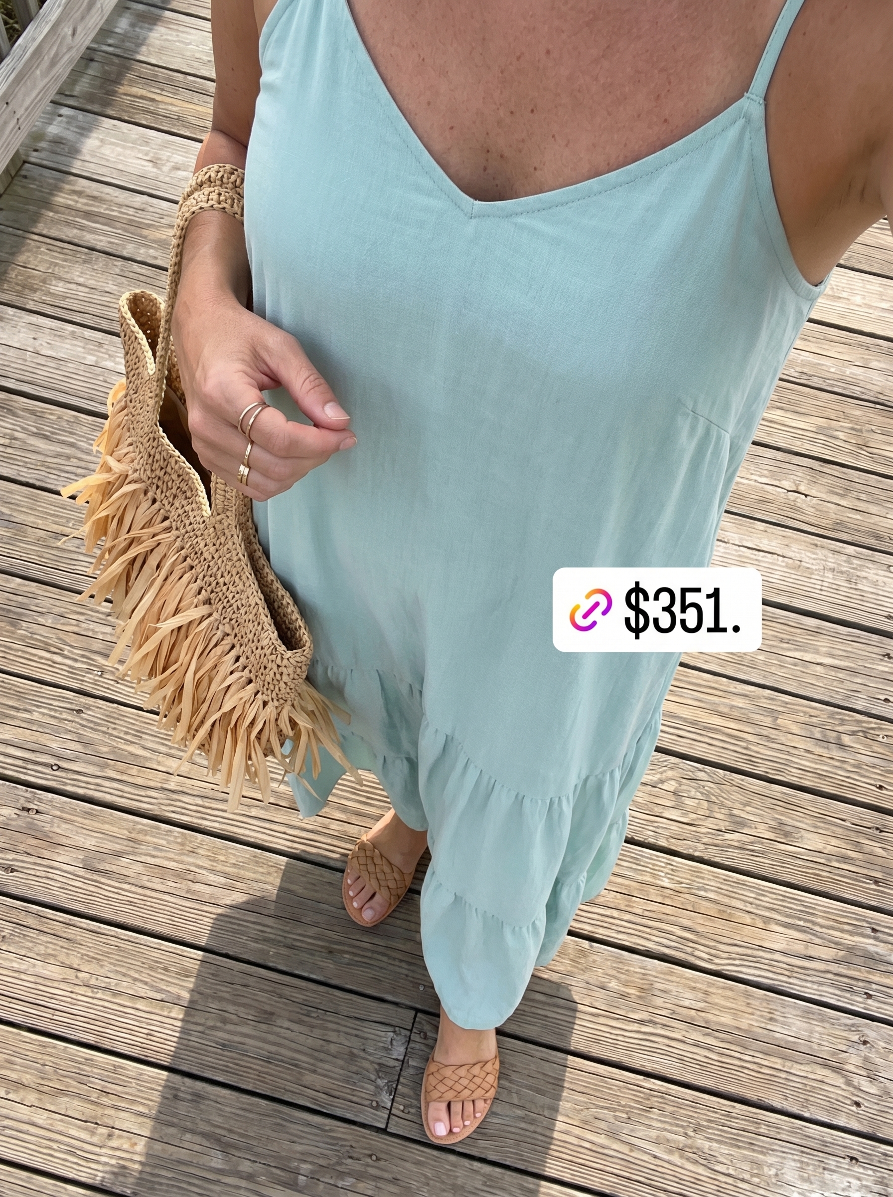 Elegant weekend getaway summer mom outfit 2026 featuring a teal crinkle cotton tiered maxi dress, beige slide sandals, a wide-brim straw hat, and a large straw tote. Ideal for resort wear.