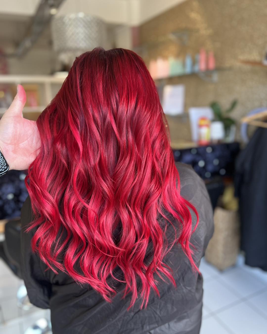 A vibrant woman with a gorgeous summer red hair color 2026, posing in a chic off-white linen dress with puffed sleeves for a tropical vacation.