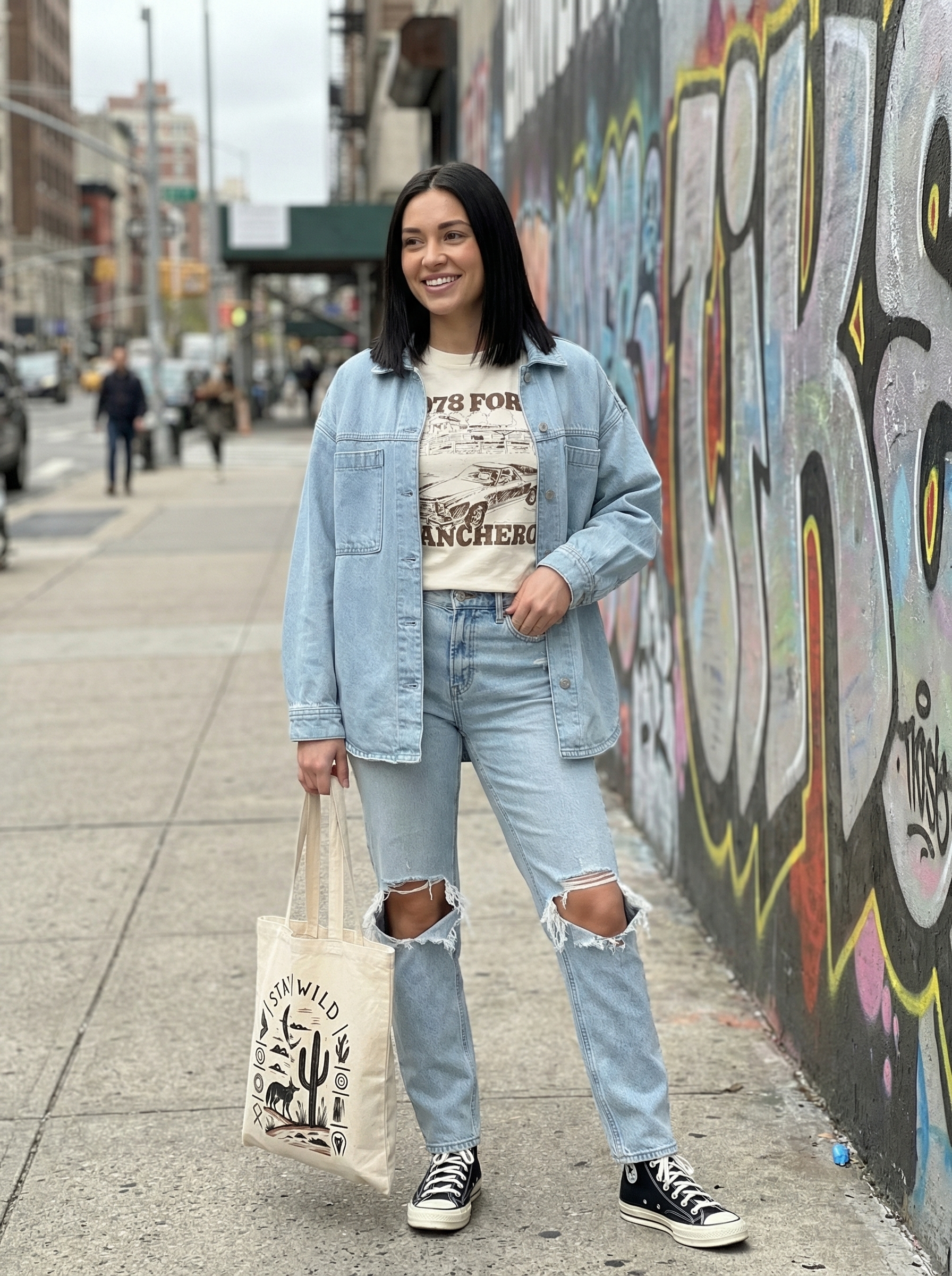 Denim Layers Summer Streetwear Outfit 2024 Relaxed light wash denim jacket, distressed jeans, graphic t-shirt, and canvas high-tops, ideal summer streetwear for casual outings.