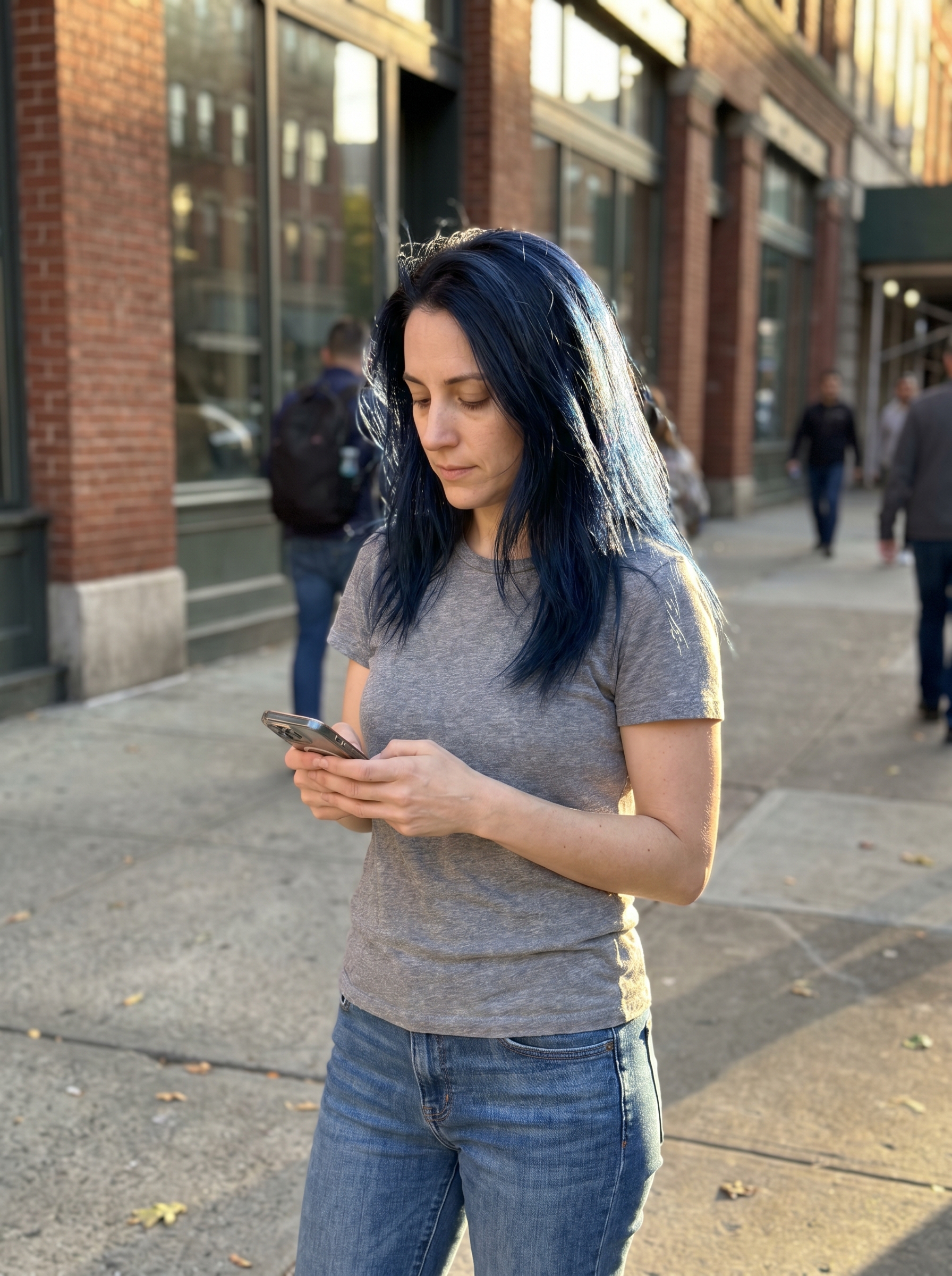 Dramatic blue-black color-treated hair showcasing true summer hair color 2026 trends, styled with anti-frizz shine serum for an everyday or special occasion bold look.
