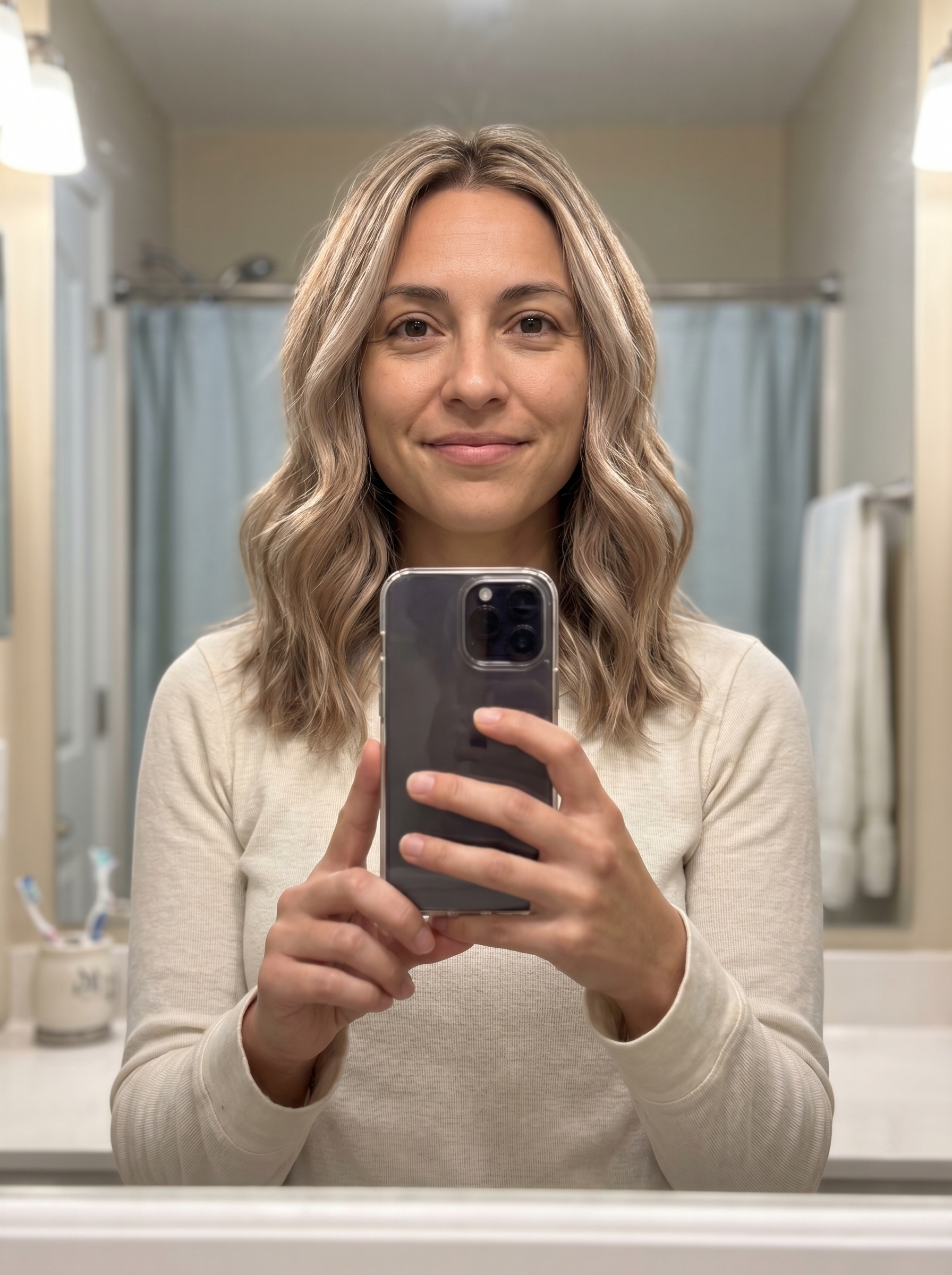 Elegant champagne frost highlighted hair, a bright take on true summer hair color 2026, maintained with violet toning shampoo for everyday elegance.
