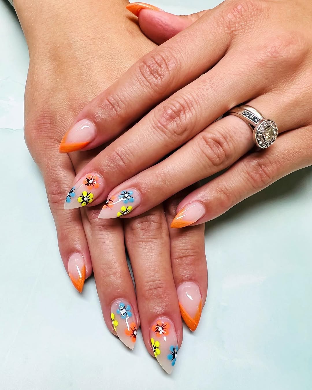 Bright Orange French Tips With Floral Accents