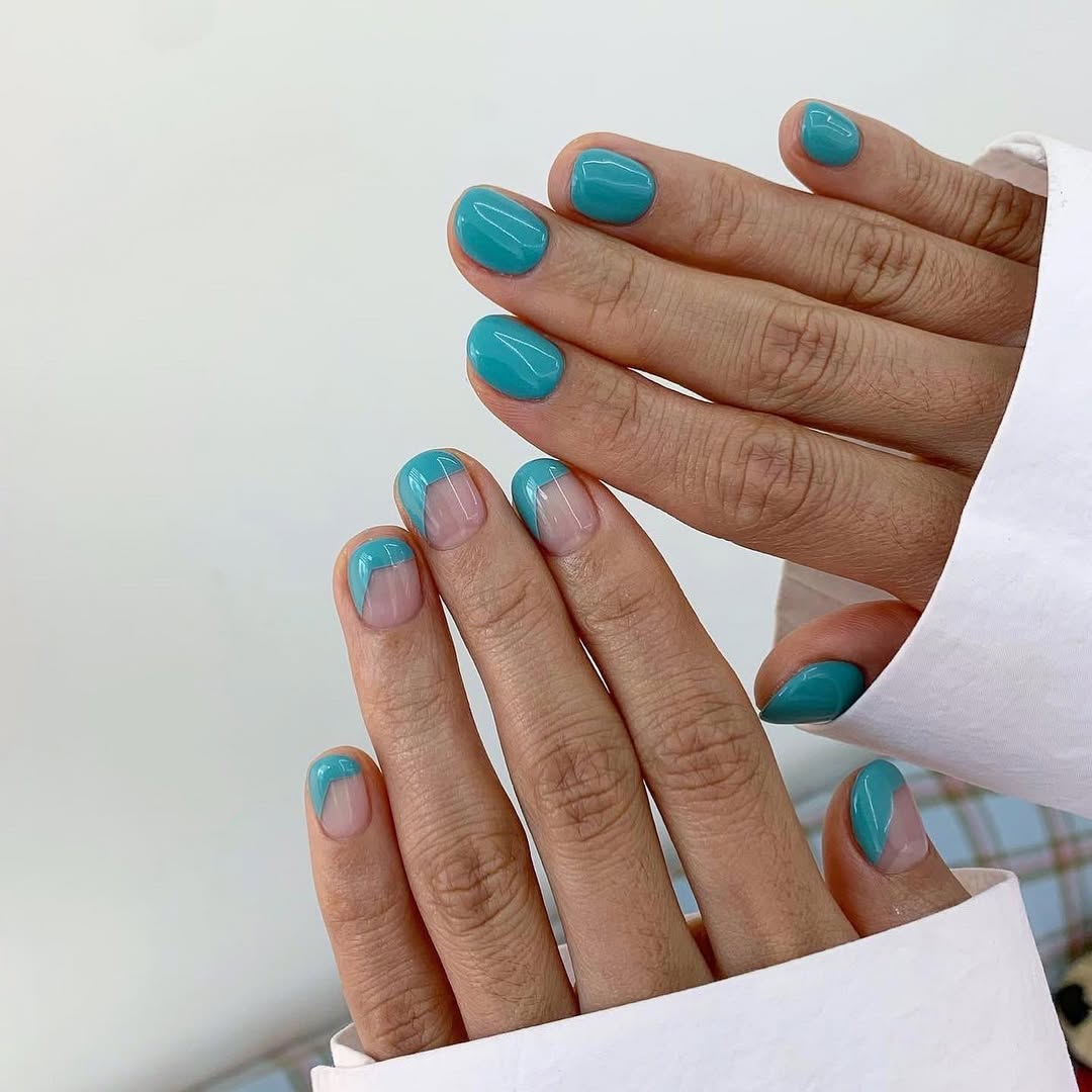 Bright Teal Asymmetrical French Tips On Short Squoval Nails