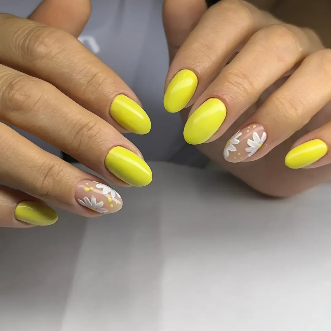 Bright Yellow Oval Nails with Daisy Accent