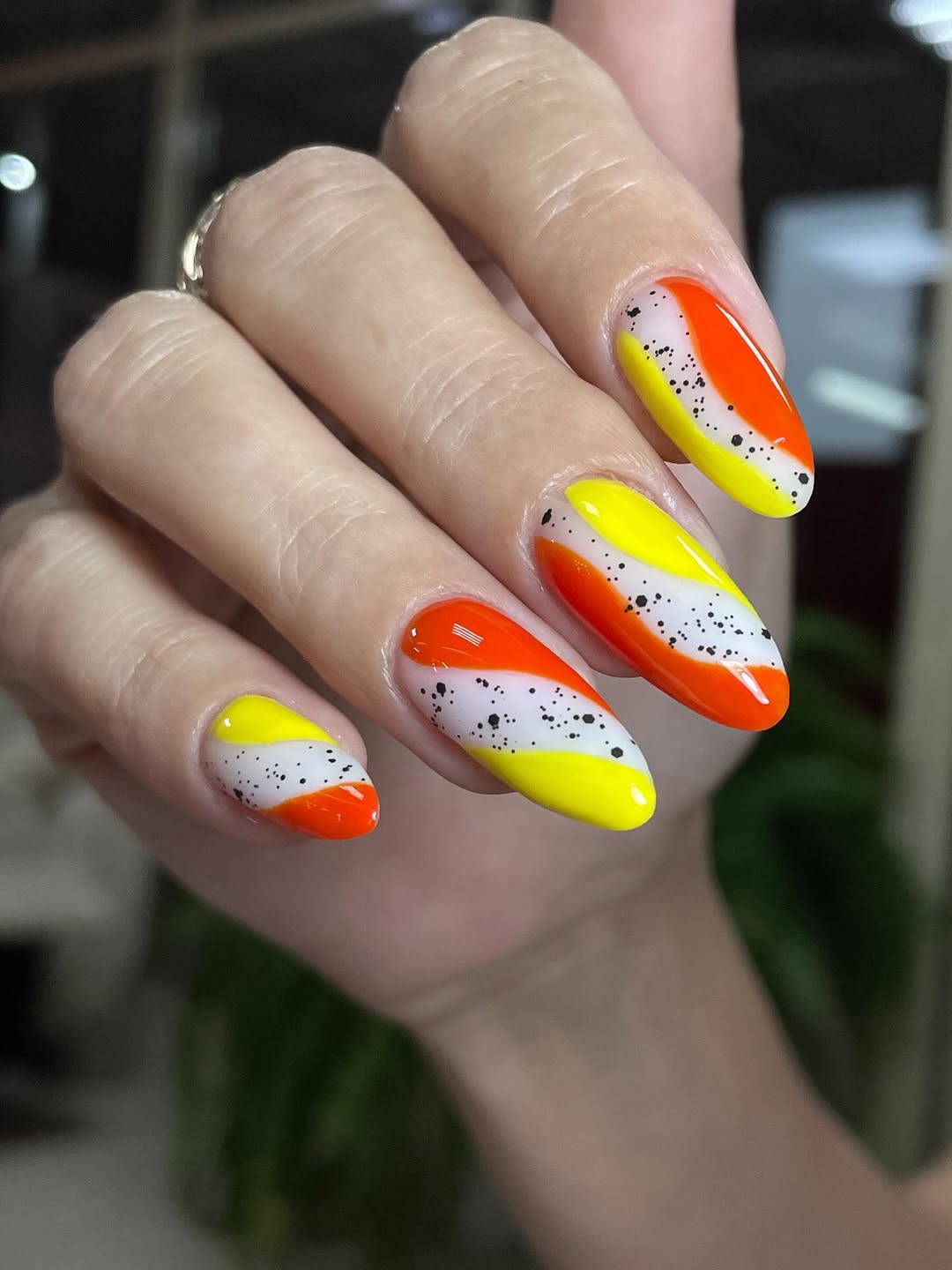 Candy Corn Swirl Almond Nails with Black Specks