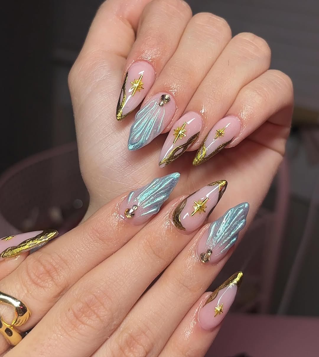 Celestial Glam Stiletto Nails with Gold Accents