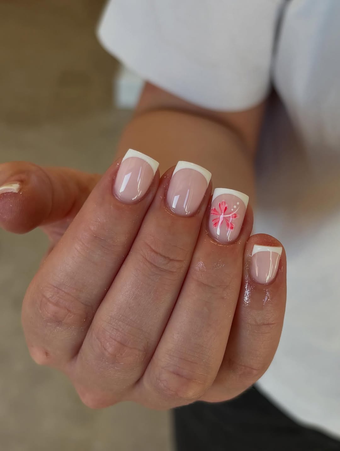 Classic French Tips with Vibrant Floral Accent