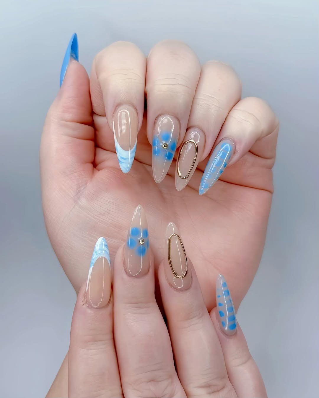 Clear Almond Blue Swirls and Floral Nail Art