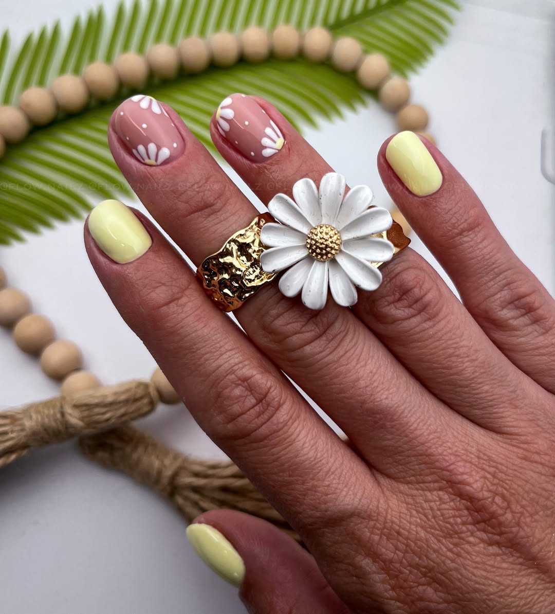 Dainty Daisy Nude and Pastel Yellow Nails