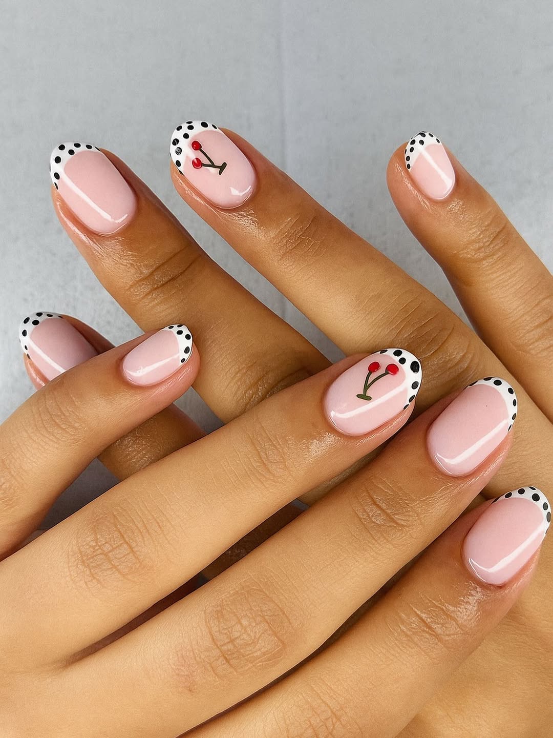Dotted French And Hand-Painted Cherry Accent Gel Manicure