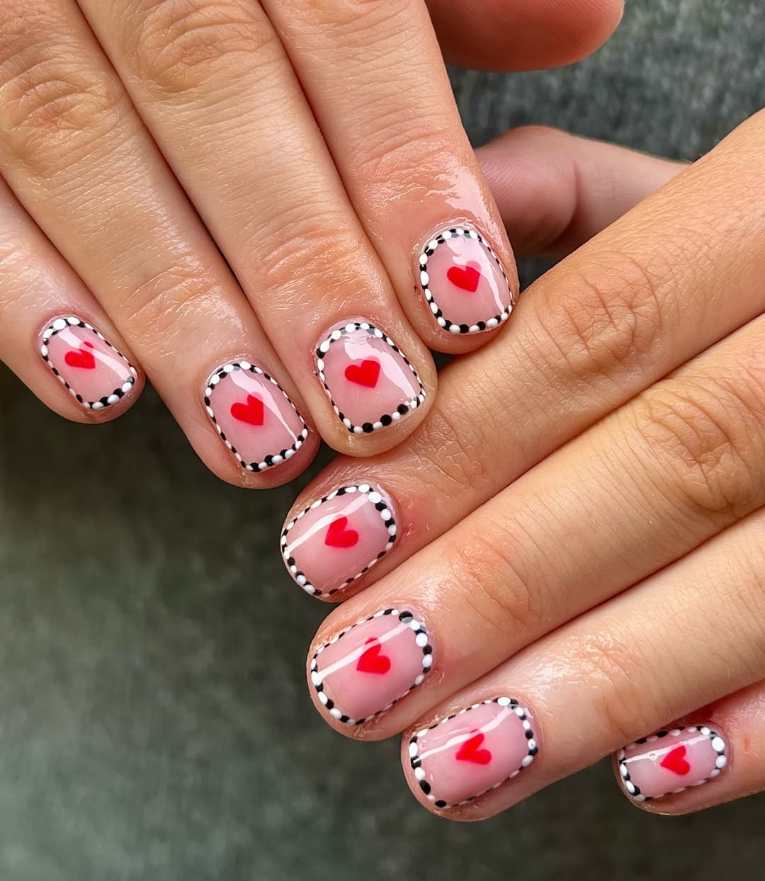 Dotted Heart Outline Glossy Pink Oval Nails