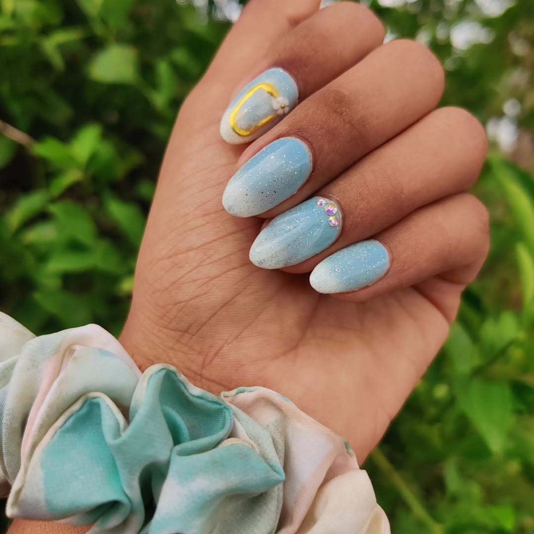 Dreamy Sky Blue Glitter Ombre Oval Nails