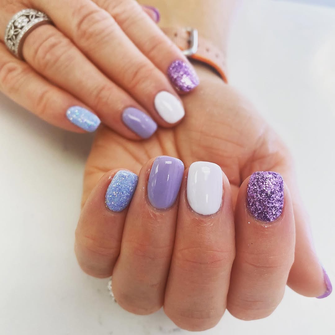Fun Mismatched Pastel Purple and Glitter Square Nails