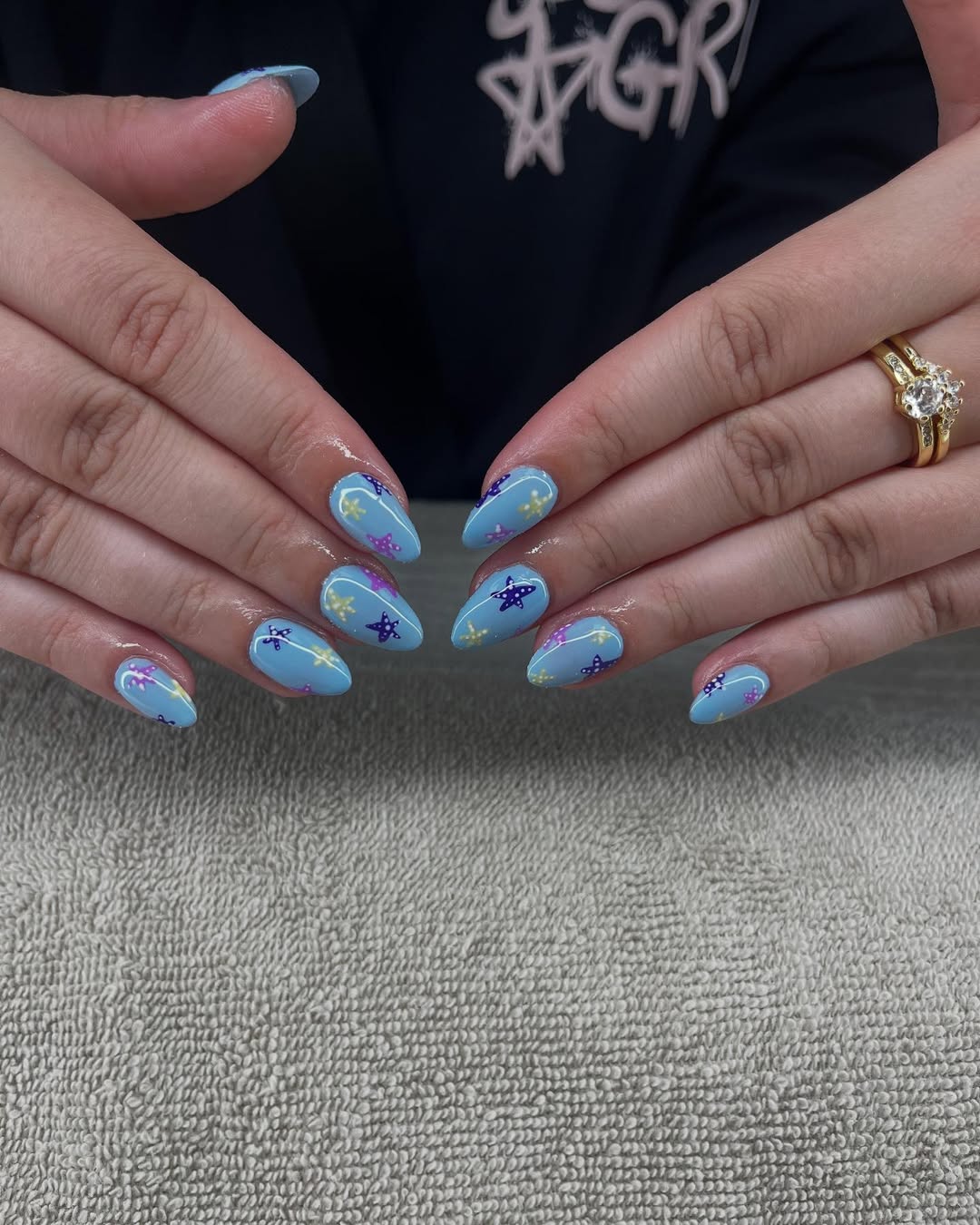 Glossy Ocean Blue Starfish Stiletto Nails
