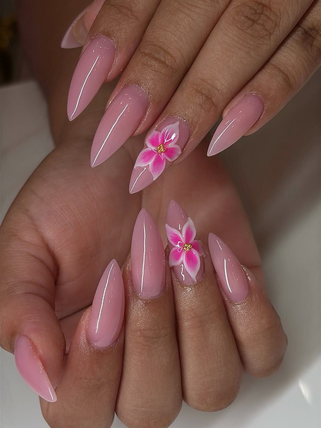 Glossy Pink Stiletto Nails with 3D Floral Art