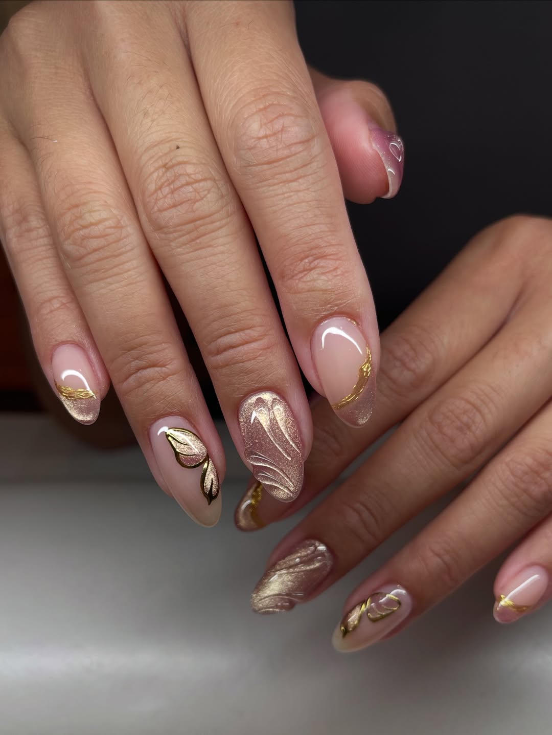 Golden Swirls and Butterfly Accents on Nude Nails