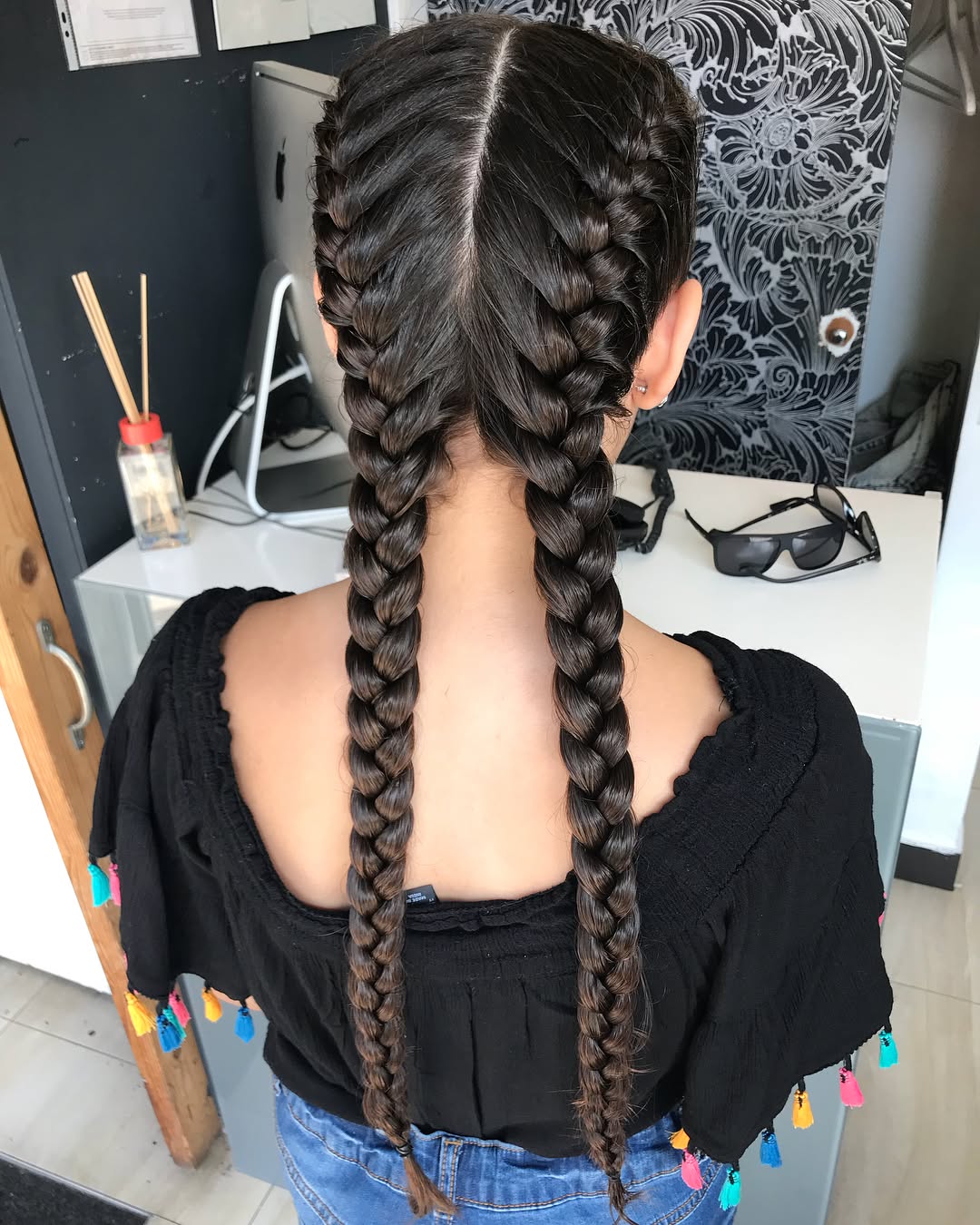 Woman in a park with a chic, high braided ponytail, perfect for hot weather, showcasing cute hairstyles for hot weather 2026.