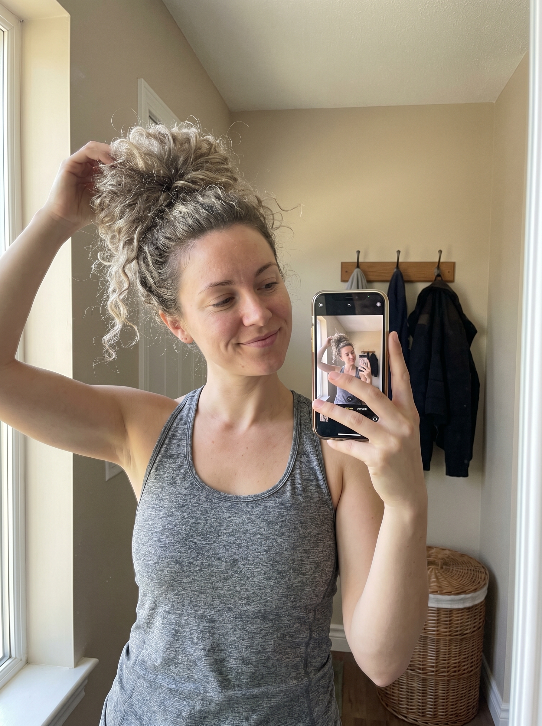 A sporty pineapple updo with a silk scrunchie, perfect for gym or beach. Discover the best hairstyles for hot weather 2026 for an active lifestyle.