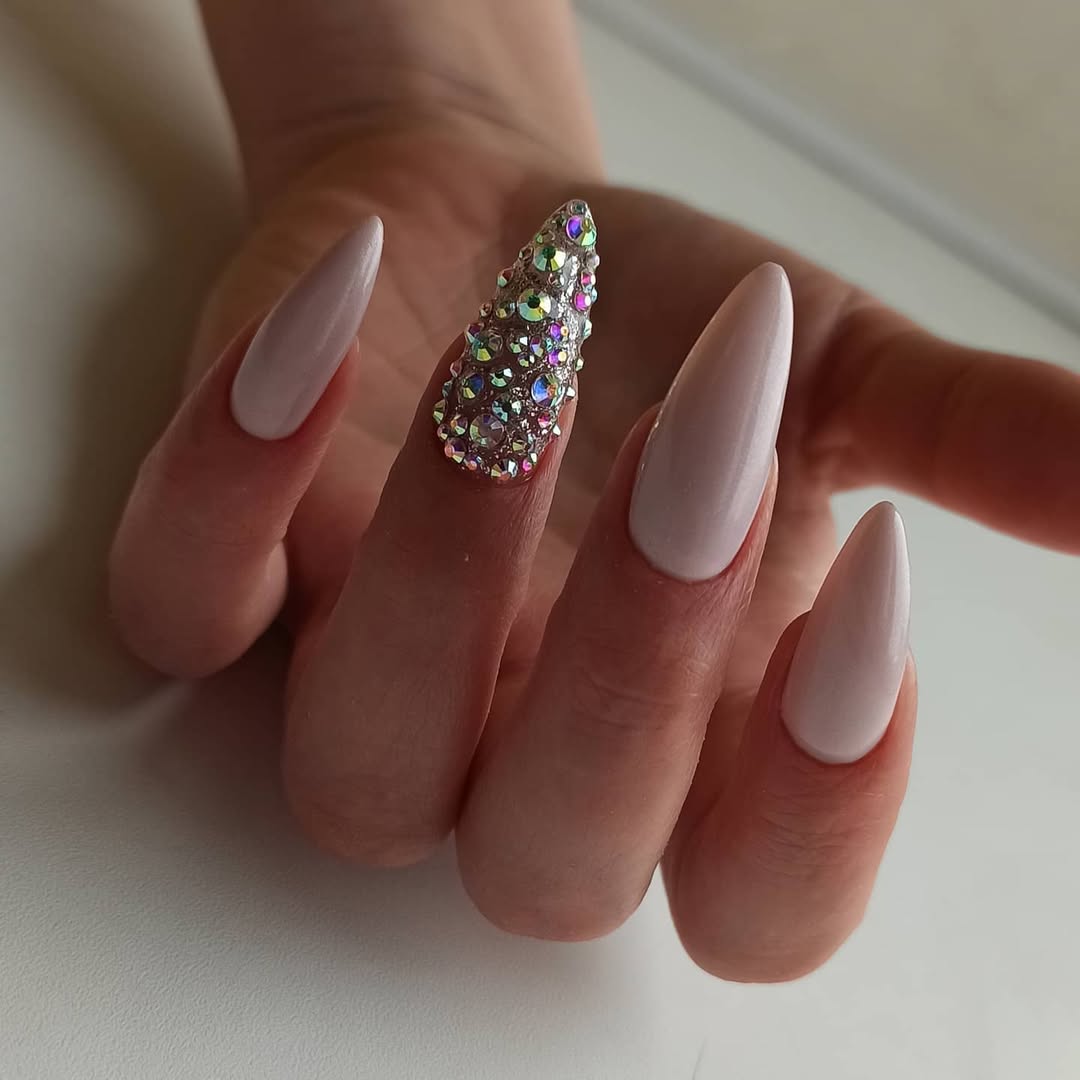 Light Pink Almond Nails With Iridescent Rhinestone Accent