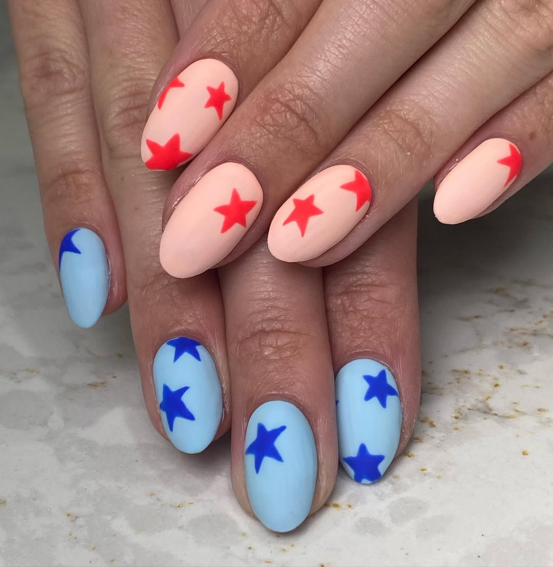 Matte Peachy Red and Blue Star Nails