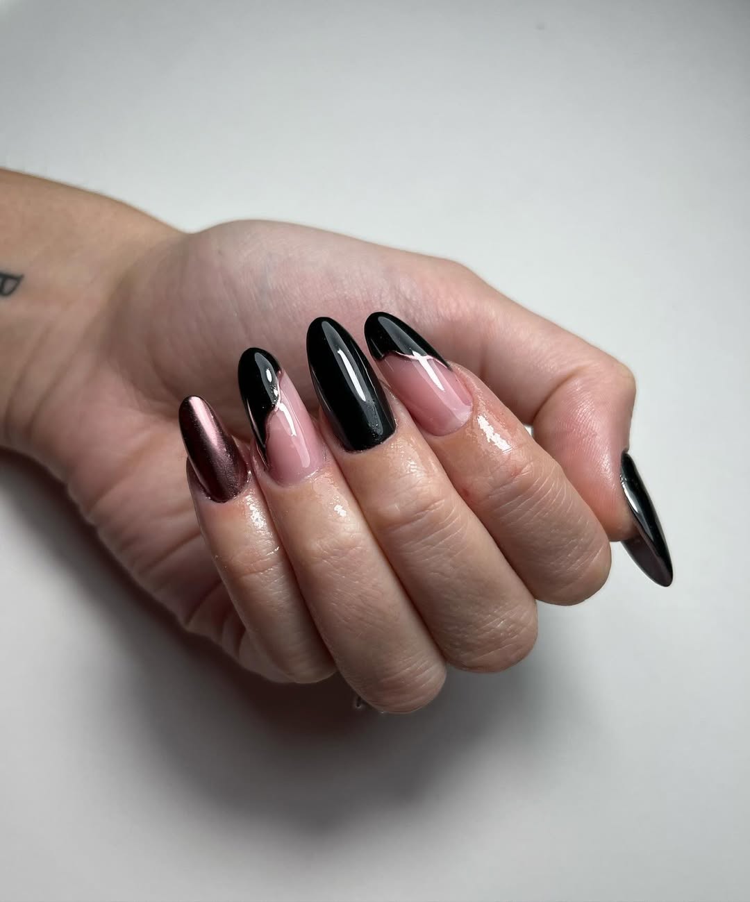 Metallic Black and Rose Gold Almond Nails