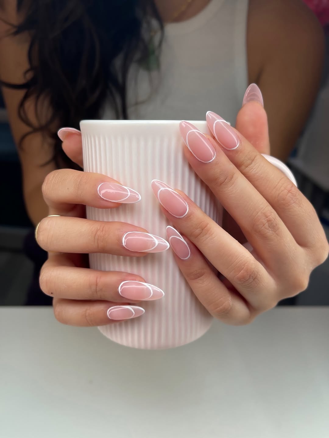 Milky Pink Outline Almond Nails with White Art