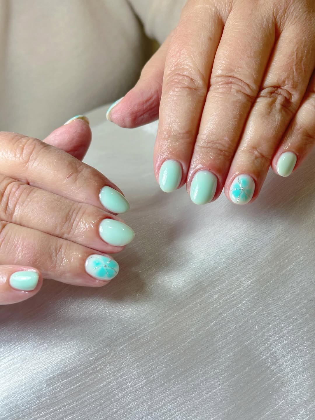 Mint Green Short Oval Nails With Floral Accent