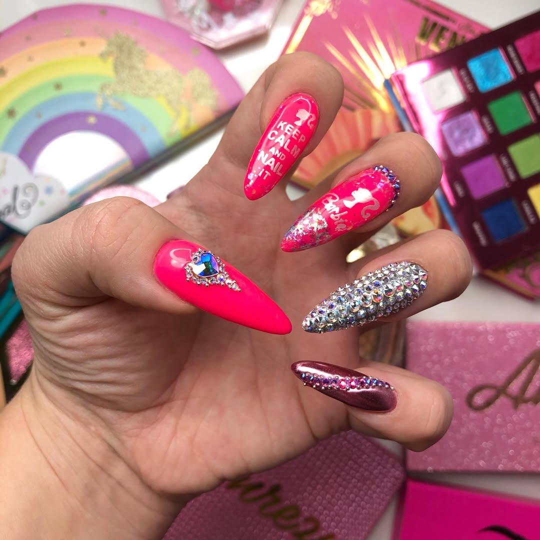 Neon Pink Stiletto Nails with Rhinestone Embellishments