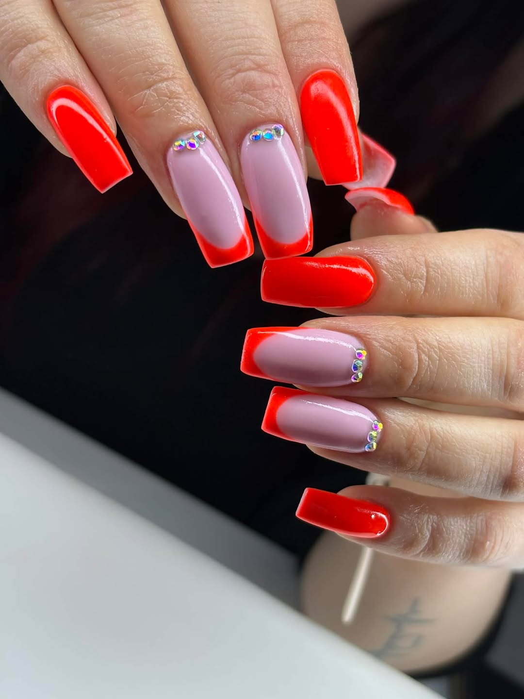 Neon Red French Tips with Pink Base and Rhinestone Accents