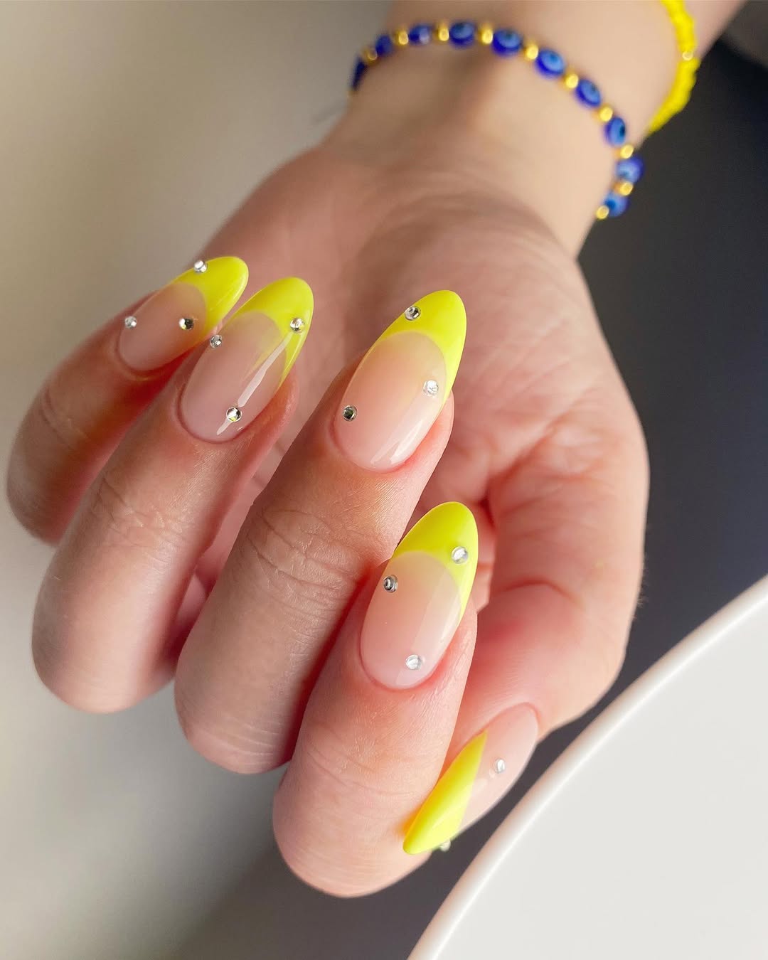 Neon Yellow French Tip Almond Nails With Rhinestones