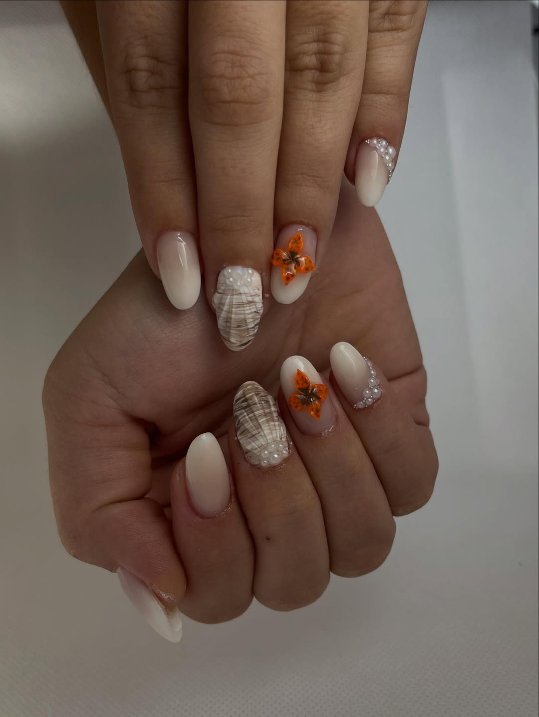 Ombre Milky Shell Nails with Pearl and Butterfly Accents