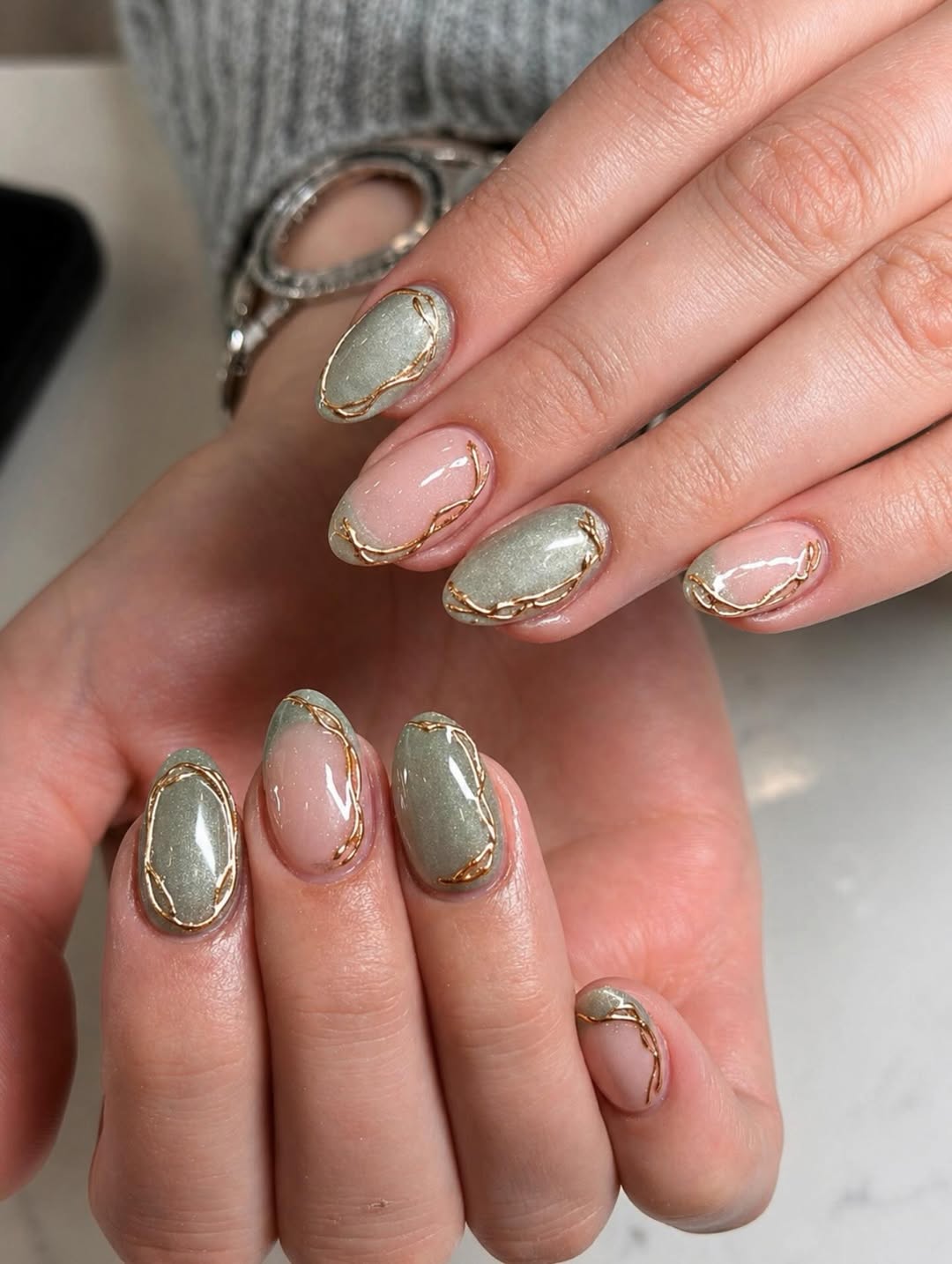 Pastel Pink and Sage Oval Nails with Gold Swirls