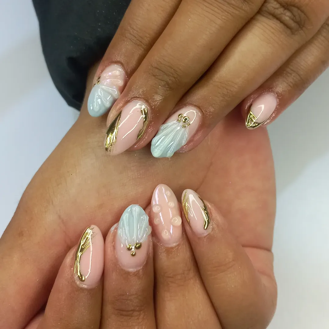 Pastel Pink Blue Shell Gold Accent Almond Nails