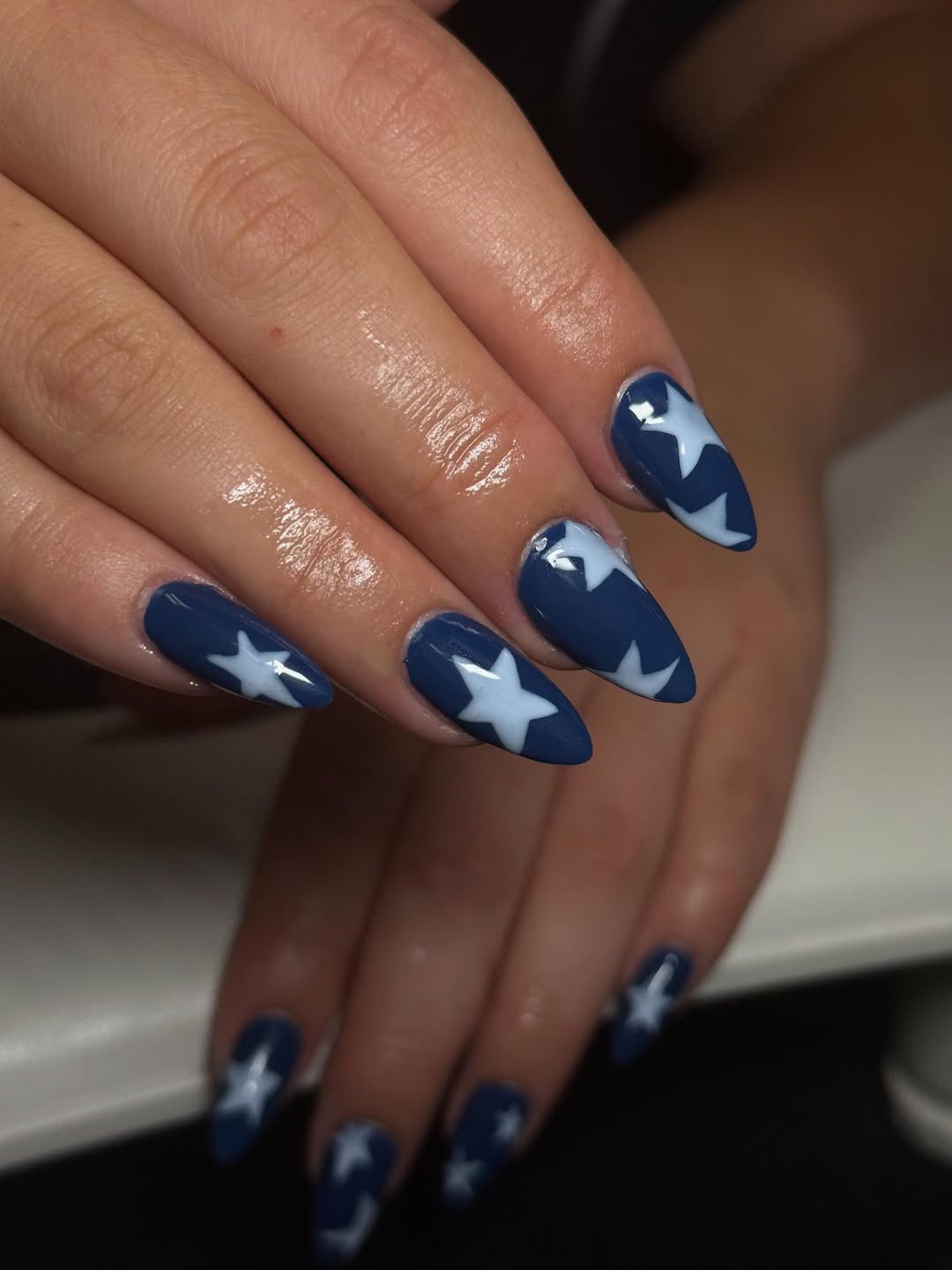 Patriotic Navy Blue Stiletto Nails with White Star Art