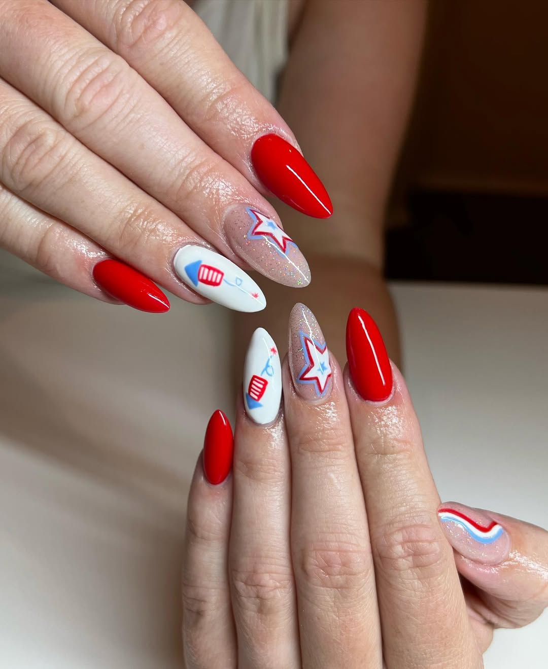 Patriotic Rocket and Star Almond Nails