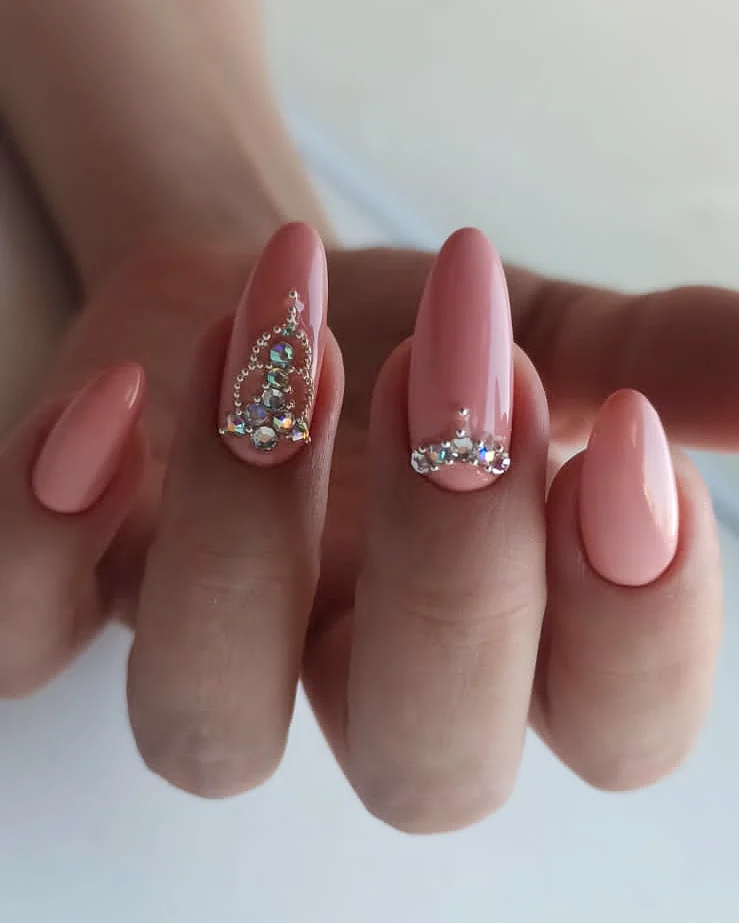 Pink Almond Nails with Rhinestone Embellishments