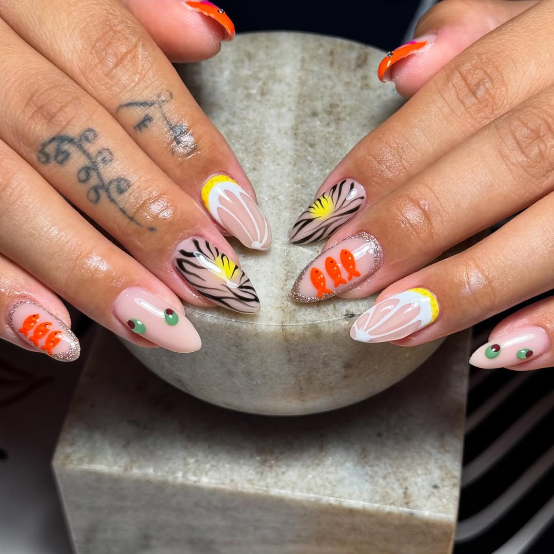 Playful Abstract Nail Art with Orange Fish and Olives