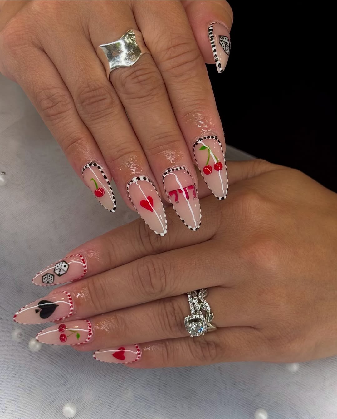 Playful Casino Luck Nude Almond Nails