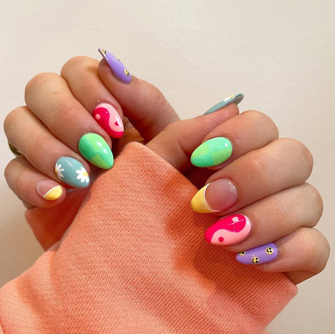 Playful Mismatched Pastel Almond Nails with Fun Designs